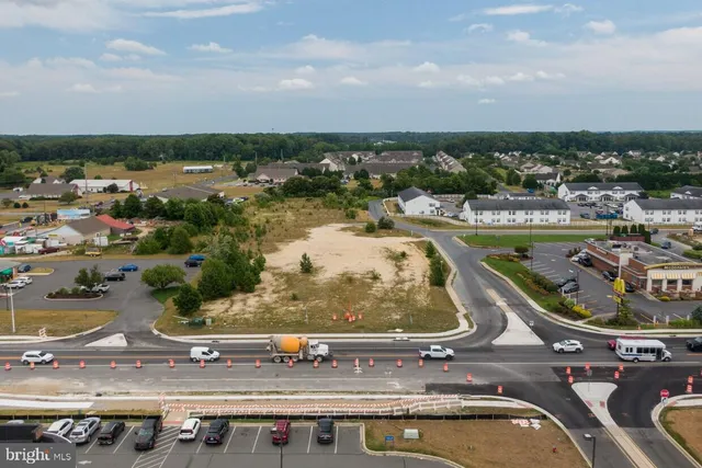 an aerial view of a residential houses with outdoor space