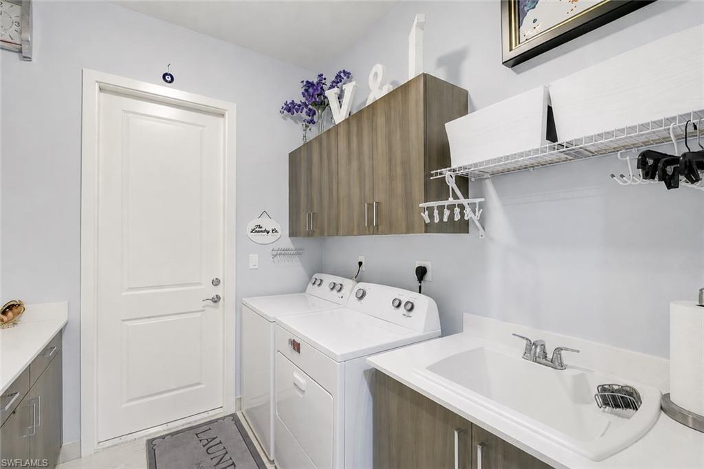 5153 Julienne Road Immokalee, FL 34142 - Photo 18 of 43 Laundry with full cabinetry & Sink