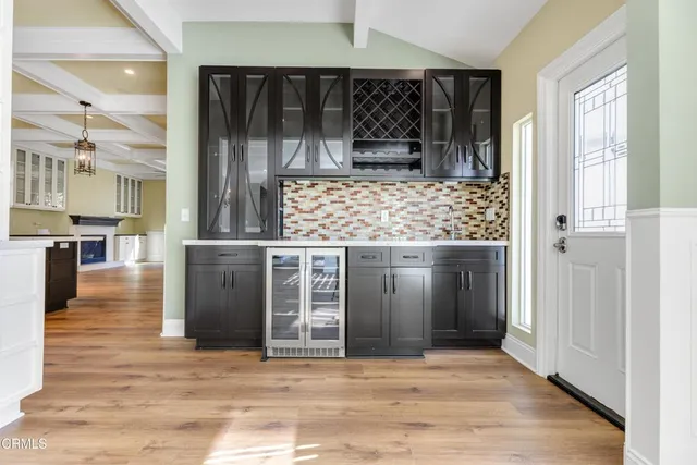 a open kitchen with a sink and cabinets