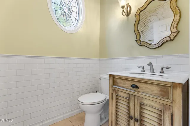 a bathroom with a toilet and a sink