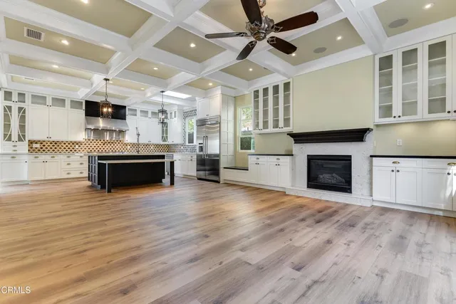 a view of a kitchen with a stove cabinets and wooden floor