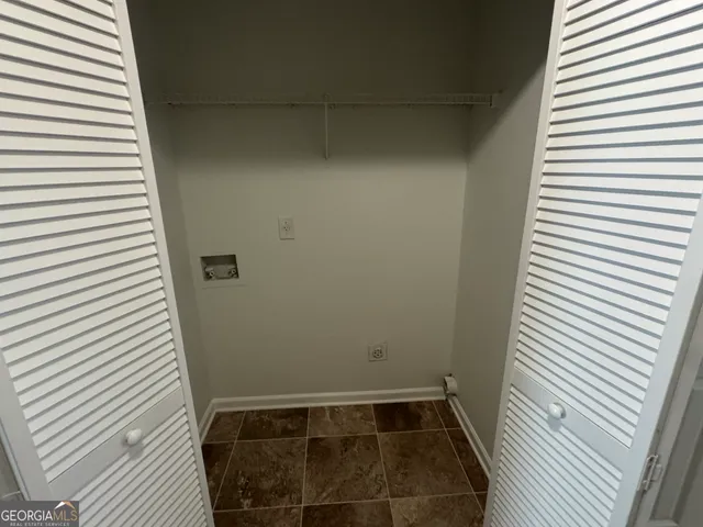 a bathroom with a toilet and a bathtub
