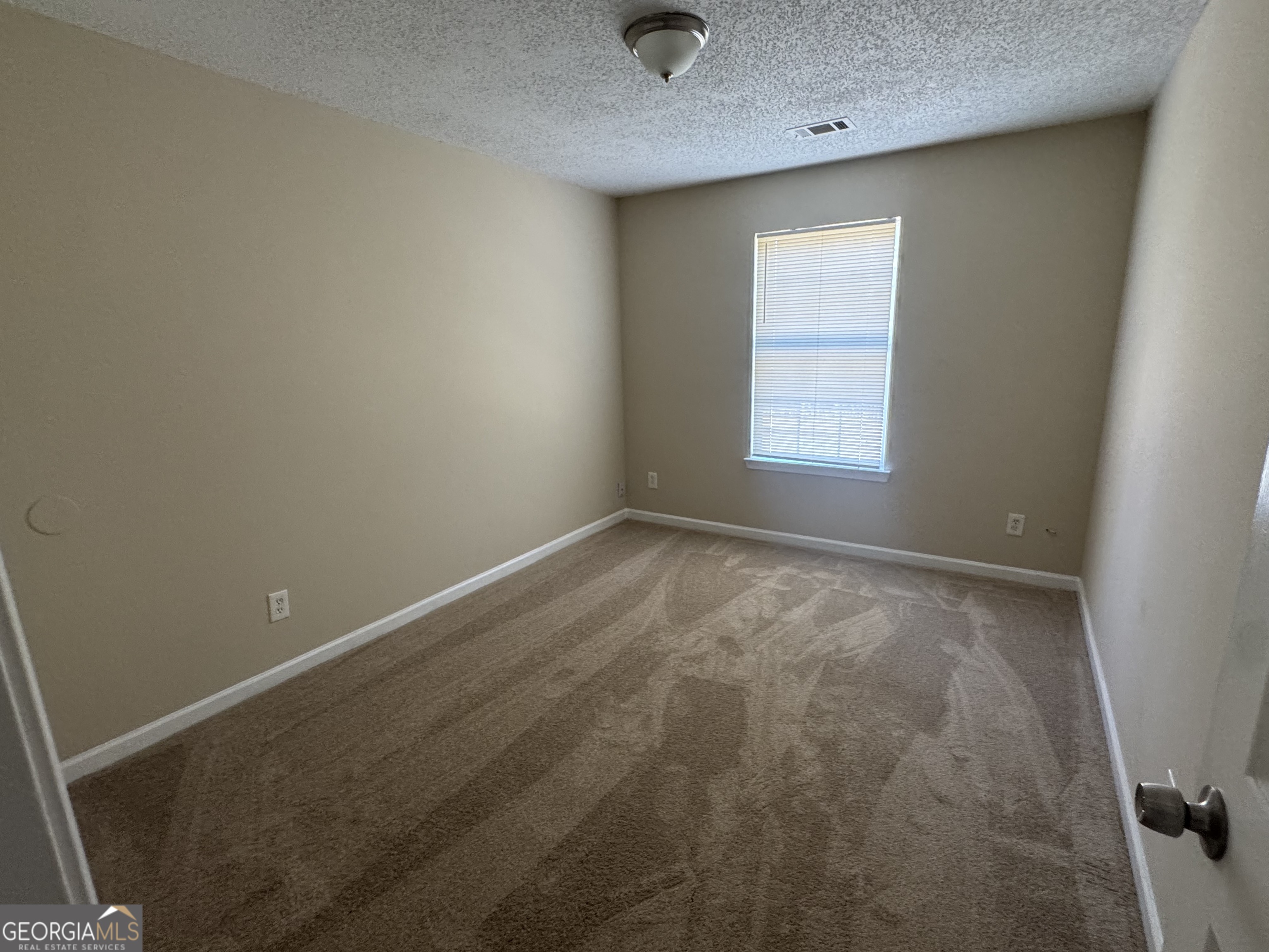 116 Pointe Court Griffin, GA 30224 - Photo 15 of 17 an empty room with a window