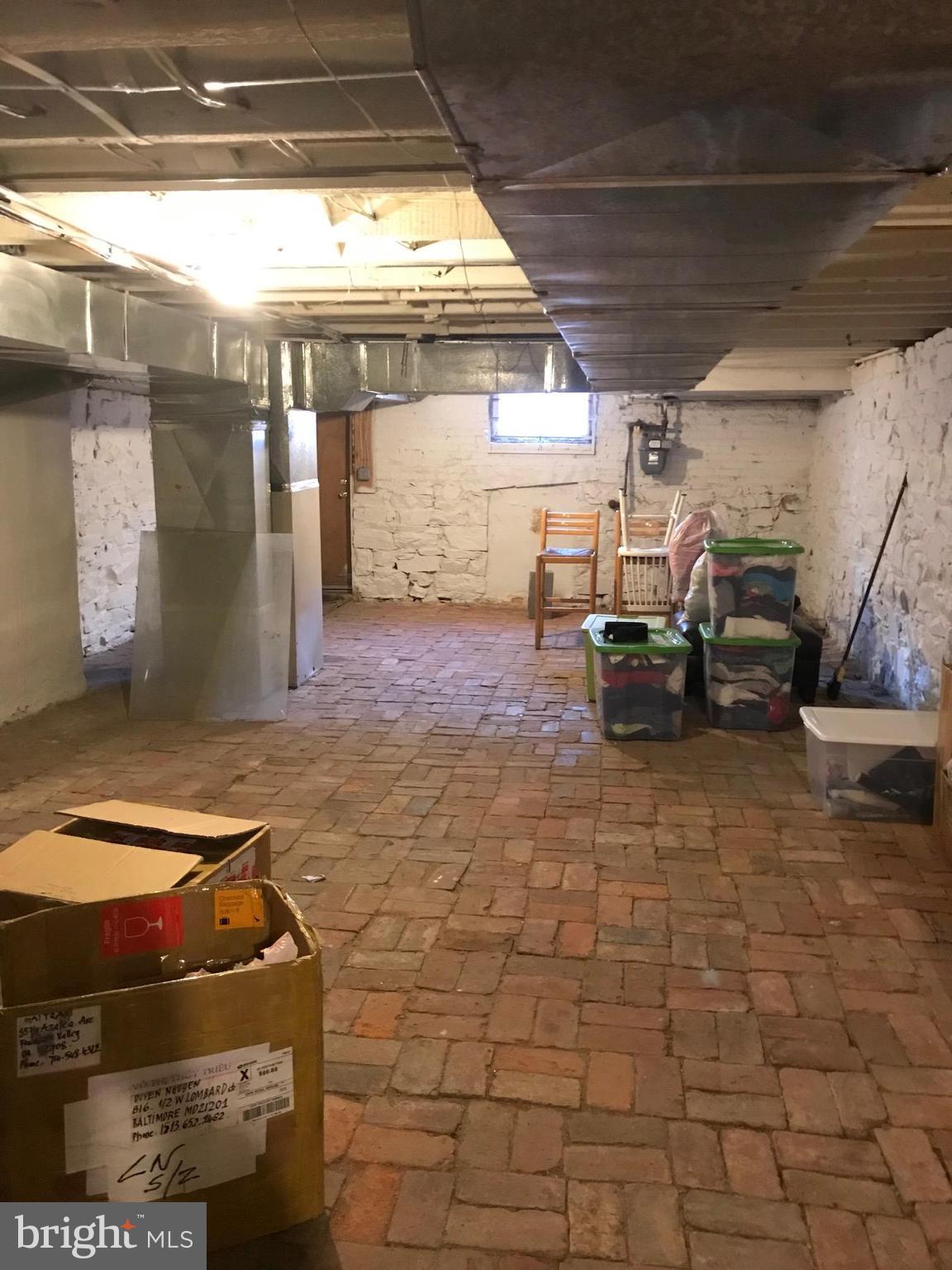 816 West Lombard Street Baltimore, MD 21201 - Photo 28 of 28 Basement boasts ample space and tons of potential