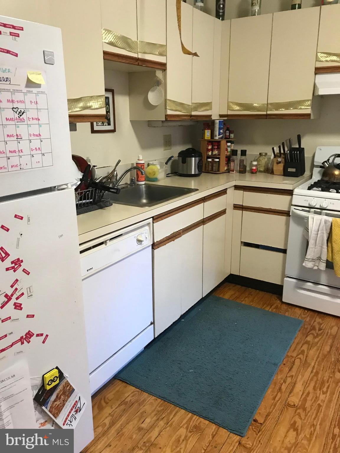 816 West Lombard Street Baltimore, MD 21201 - Photo 8 of 28 Open Kitchen from Family Room Leads to Backyard