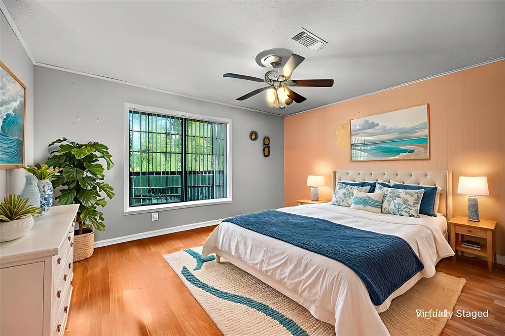 8850 Highway 1200 Boyce, LA 71409 - Photo 12 of 23 a spacious bedroom with a large bed and a window