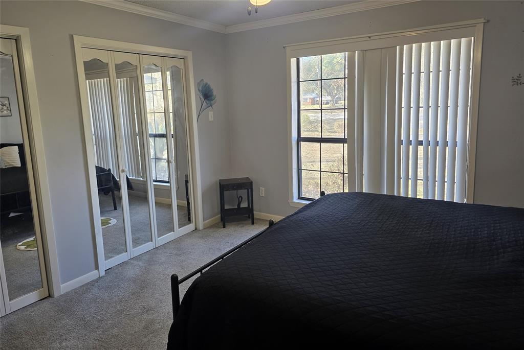 8850 Highway 1200 Boyce, LA 71409 - Photo 14 of 23 a bedroom with a bed and a window