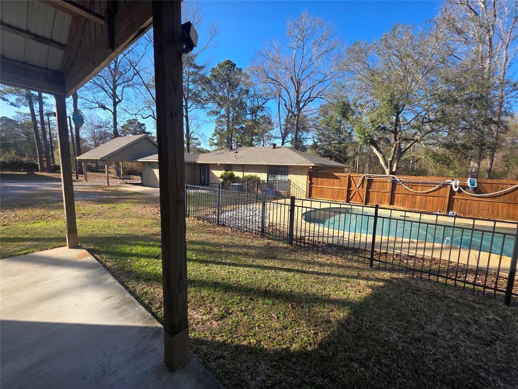 8850 Highway 1200 Boyce, LA 71409 - Photo 16 of 23 a view of a porch with a floor to ceiling window next to a yard