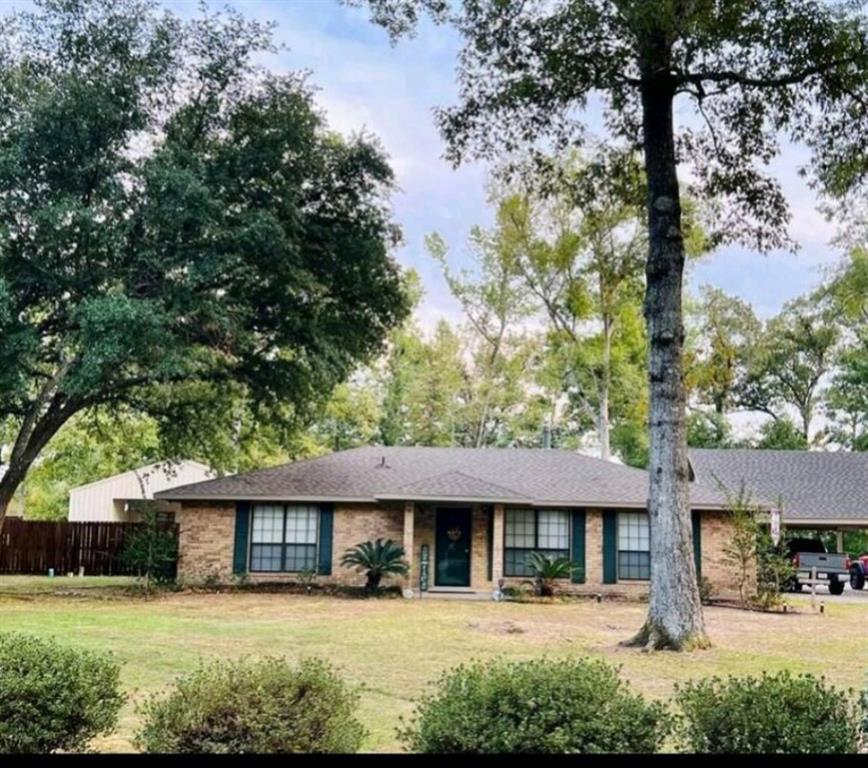 8850 Highway 1200 Boyce, LA 71409 - Photo 3 of 23 a front view of a house with a yard table and chairs