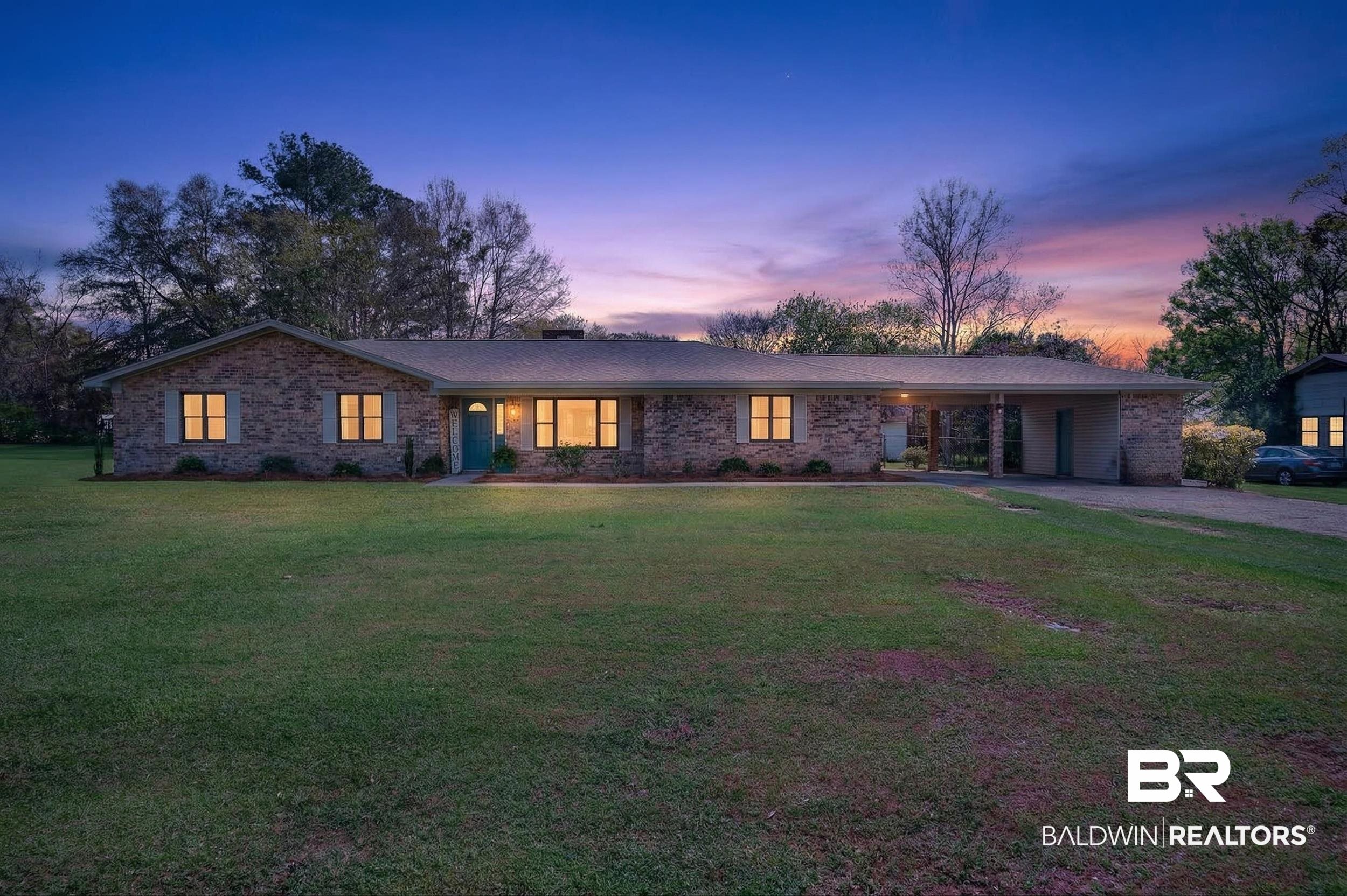 46006 Pecan Lane Bay Minette, AL 36507 - Photo 1 of 40 View of front of property featuring an attached carport, a front yard, driveway, and brick siding
