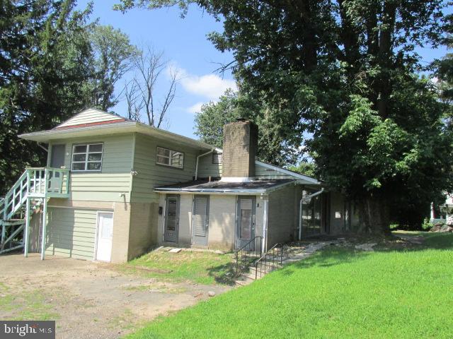 1048 Upper River Road Ewing, NJ 08628 - Photo 14 of 14 a view of a house with a yard