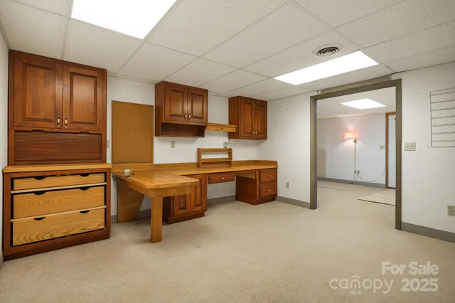 a spacious bedroom with a bed and furniture