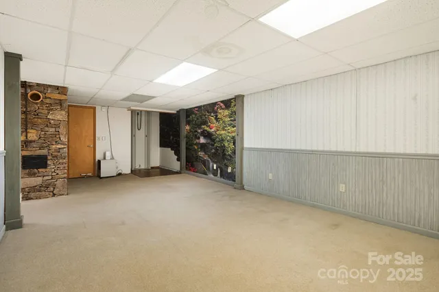 a view of an empty room with a fireplace