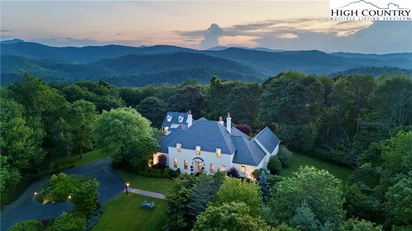an aerial view of a house with mountain view