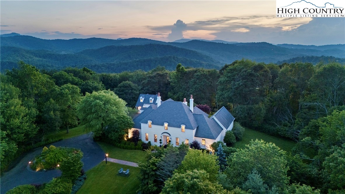 1920 Deck Hill Road Blowing Rock, NC 28605 - Photo 1 of 50 an aerial view of a house with mountain view