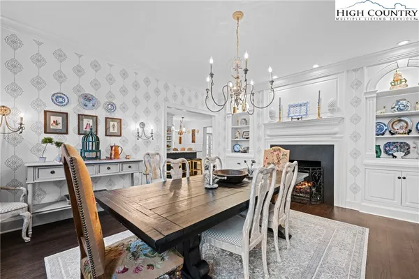 a room with pool table and a rug