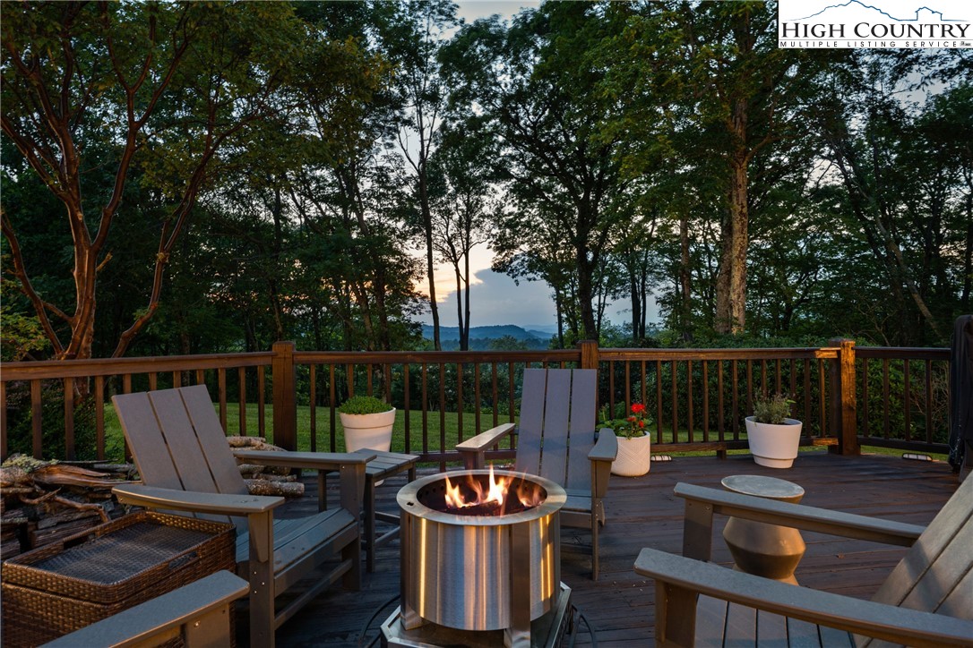 1920 Deck Hill Road Blowing Rock, NC 28605 - Photo 21 of 50 a view of a roof deck with couches and potted plants