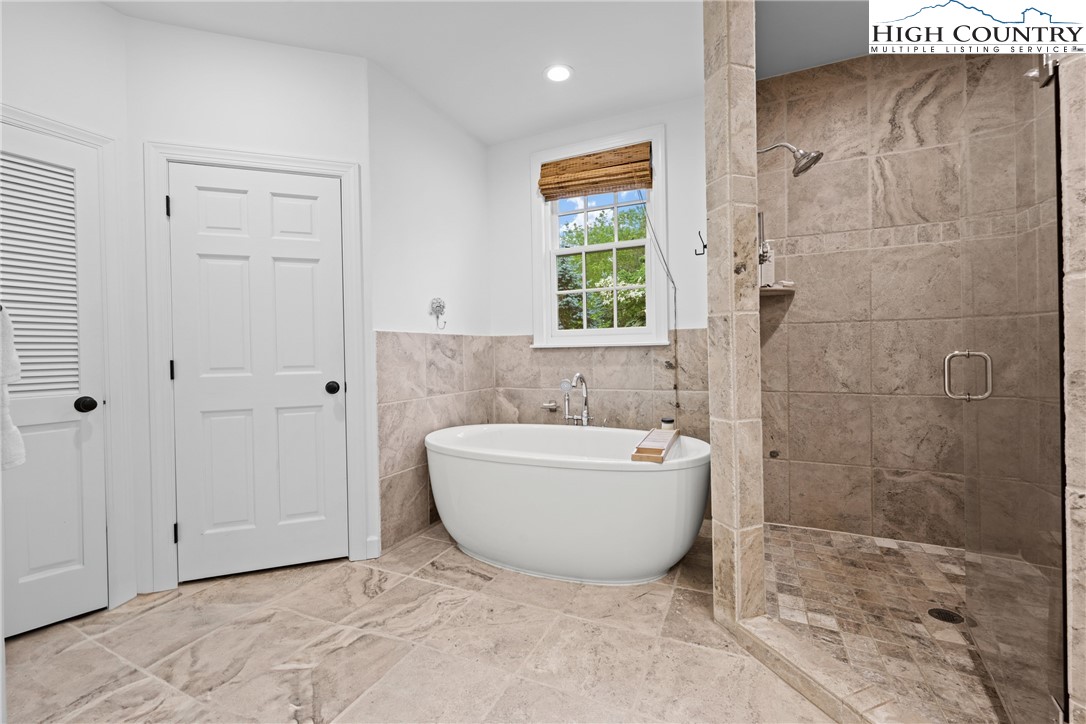 1920 Deck Hill Road Blowing Rock, NC 28605 - Photo 26 of 50 a bathroom with a bathtub and shower