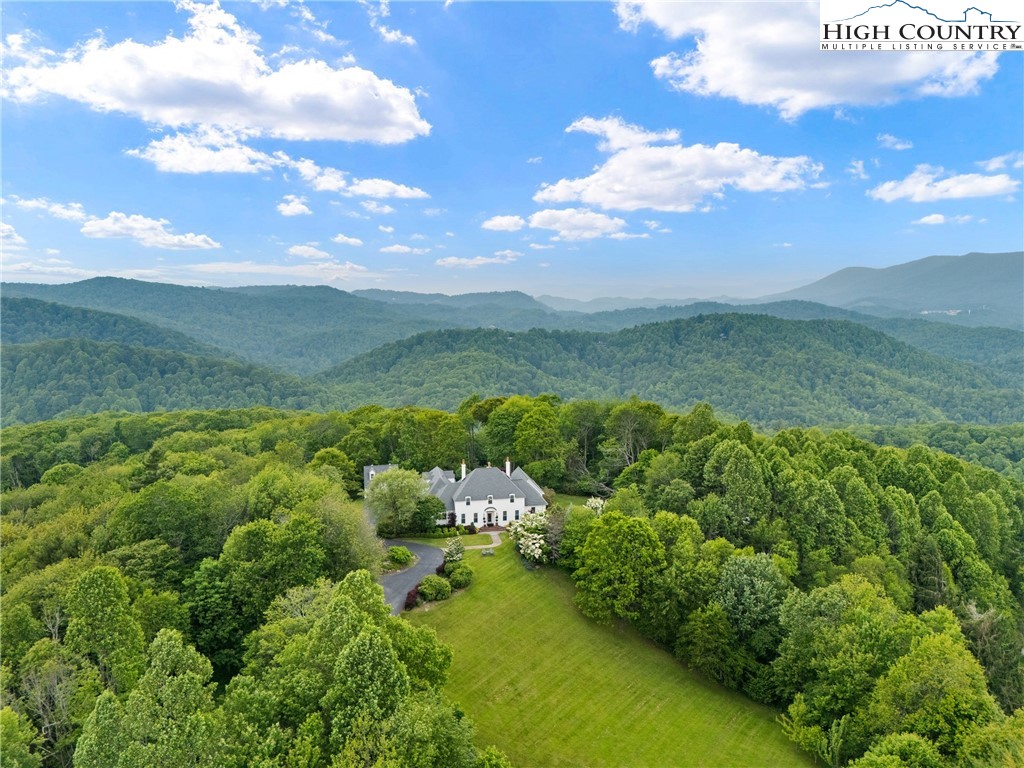 1920 Deck Hill Road Blowing Rock, NC 28605 - Photo 3 of 50 a view of a lake with a mountain