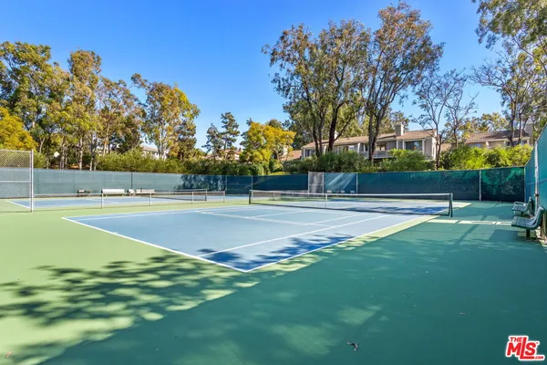 a view of a patio with a table chairs and a patio