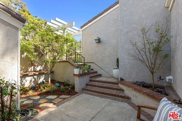 a kitchen with stainless steel appliances kitchen island granite countertop a stove a sink and a microwave