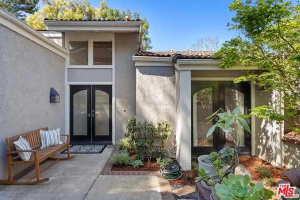 a bathroom with a double vanity sink mirror and shower