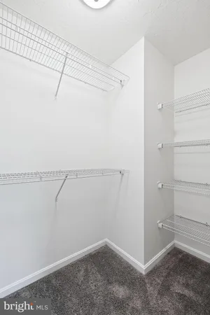 a view of a room with racks on the wall