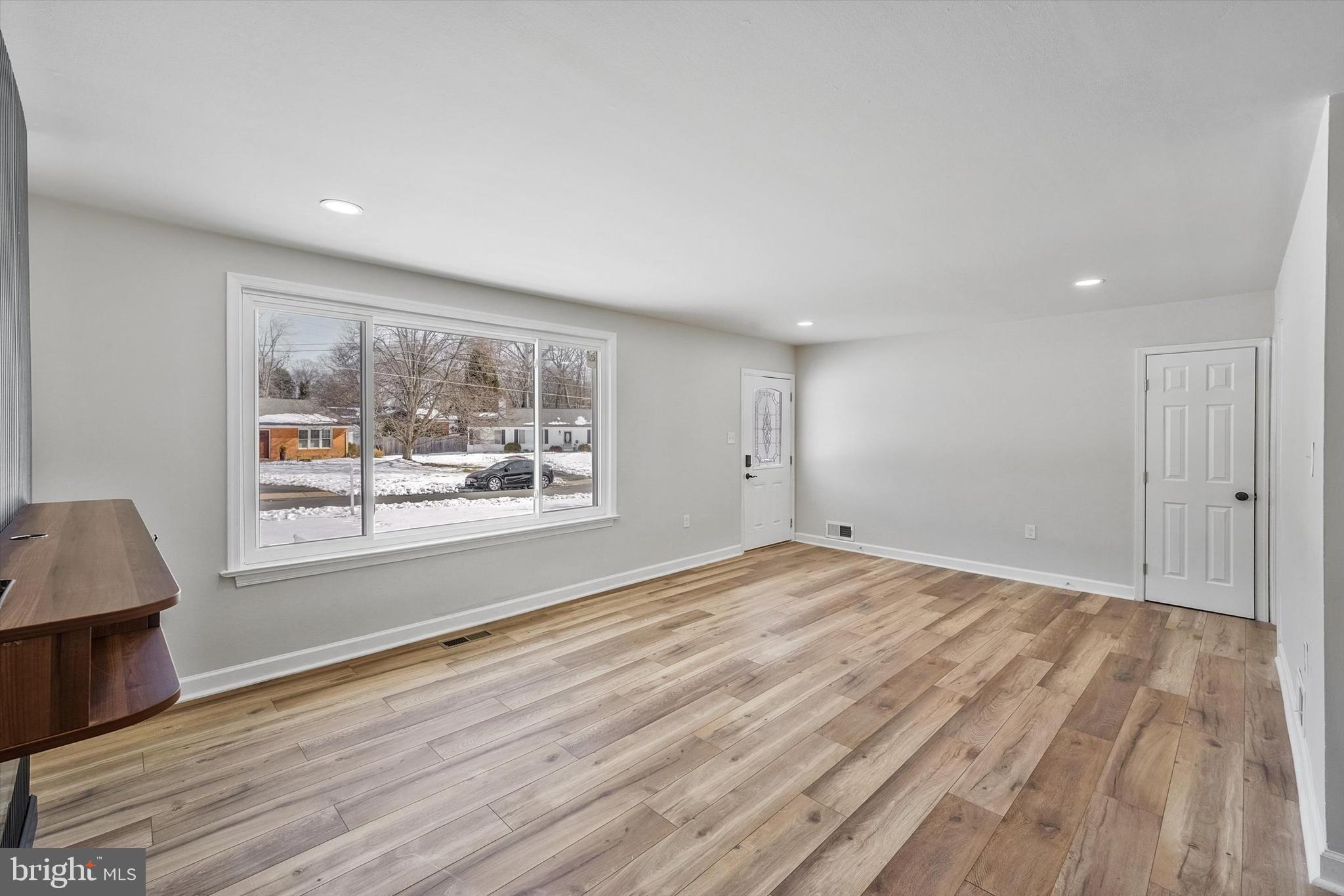 3629 Parklane Road Fairfax, VA 22030 - Photo 13 of 45 a view of an empty room with wooden floor and a window