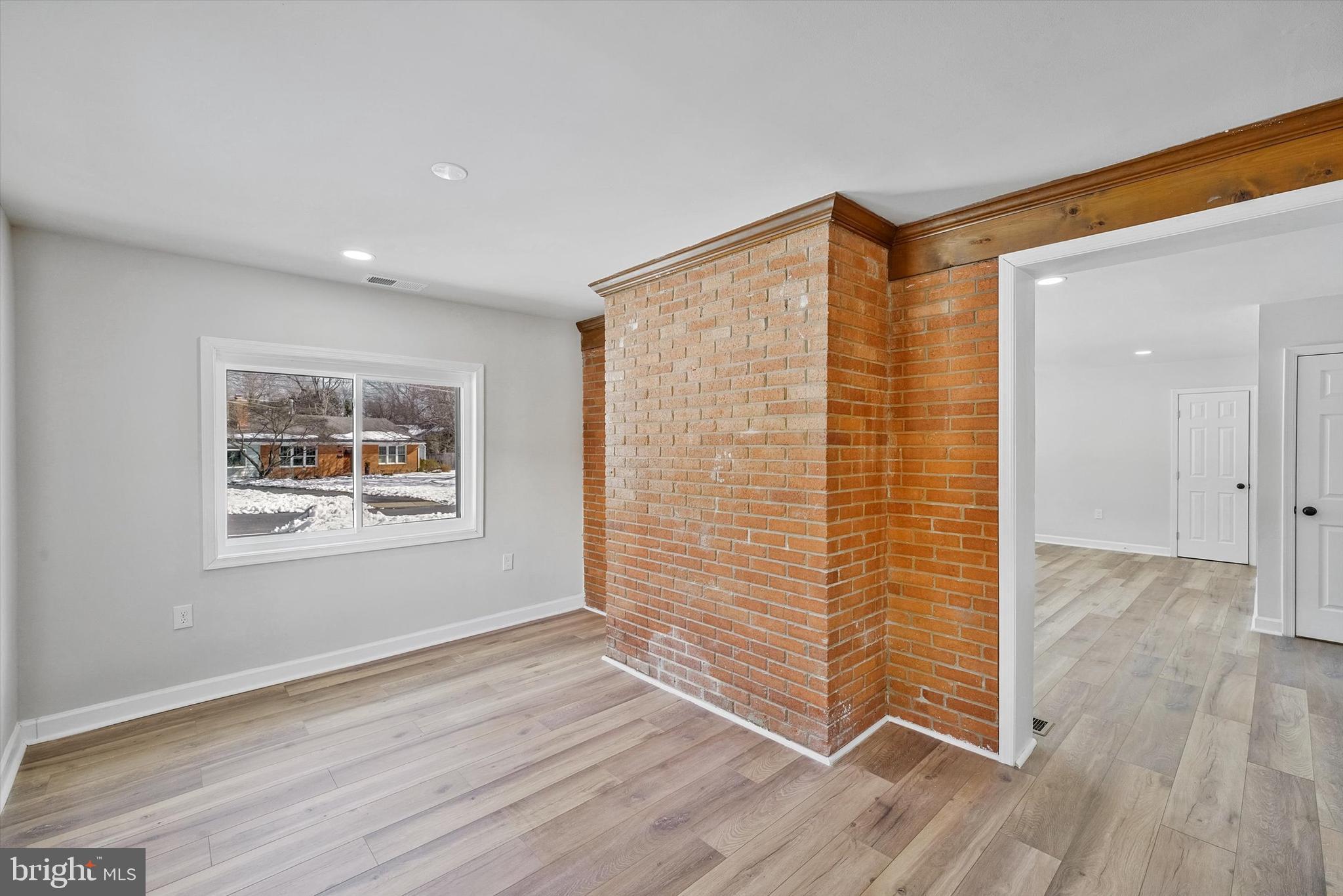 3629 Parklane Road Fairfax, VA 22030 - Photo 17 of 45 an empty room with wooden floor and windows