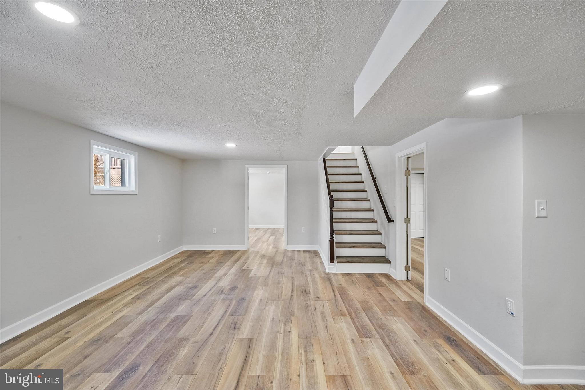 3629 Parklane Road Fairfax, VA 22030 - Photo 24 of 45 a view of a room with wooden floor staircase and a hallway