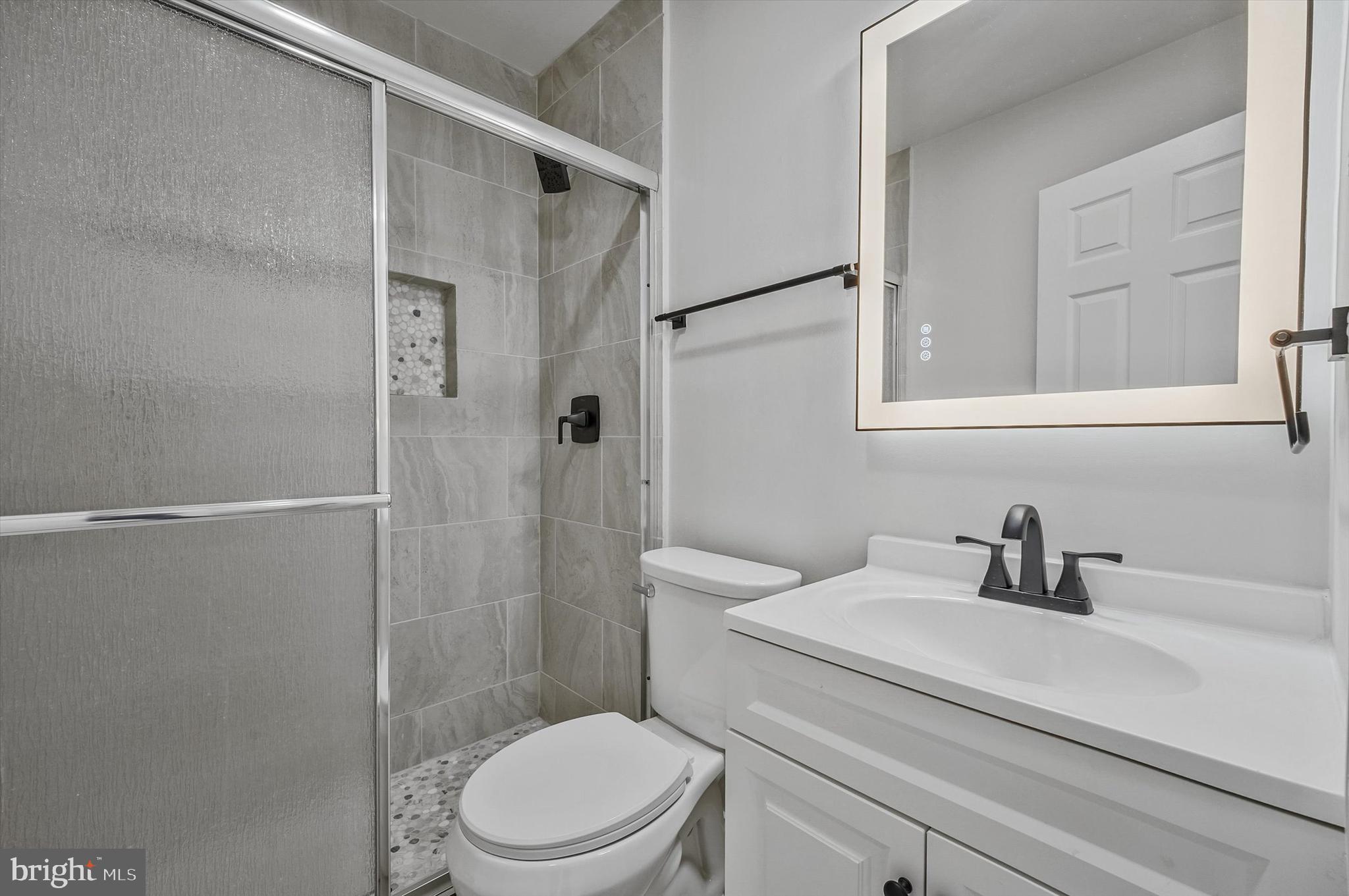 3629 Parklane Road Fairfax, VA 22030 - Photo 28 of 45 a bathroom with a sink a toilet and shower