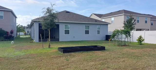 a view of a terrace with lawn chairs
