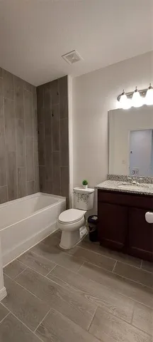 a kitchen with granite countertop kitchen island a sink appliances and a counter top space