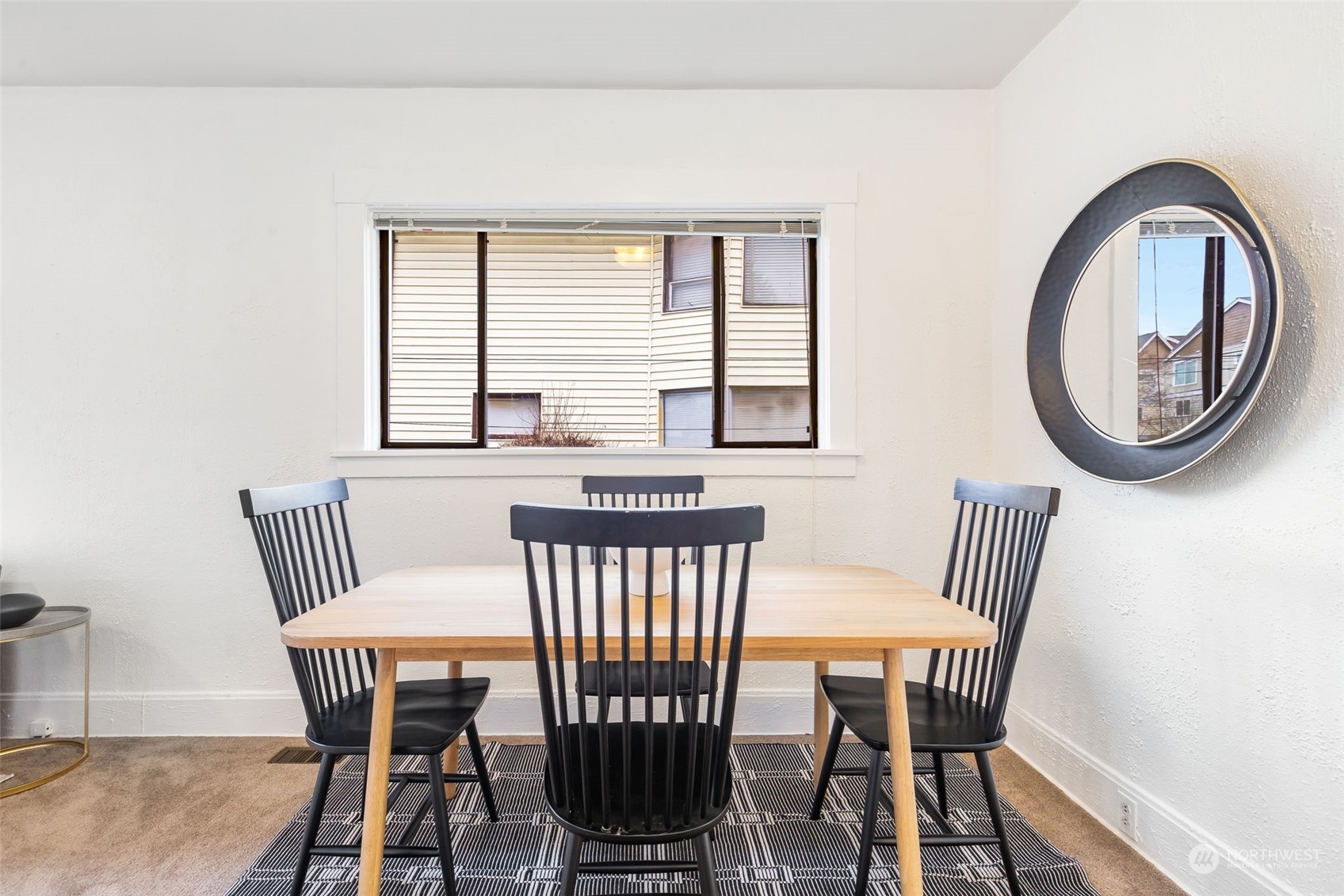 1122 26th Avenue Seattle, WA 98122 - Photo 5 of 17 a view of a dining room with furniture and a window
