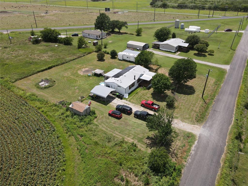 15962 Fritcher Road Pilot Point, TX 76258 - Photo 5 of 24 an aerial view of a house with a yard