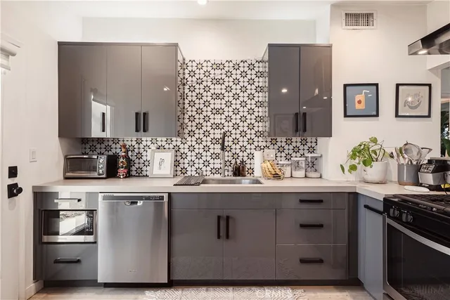 a kitchen with a sink and cabinets