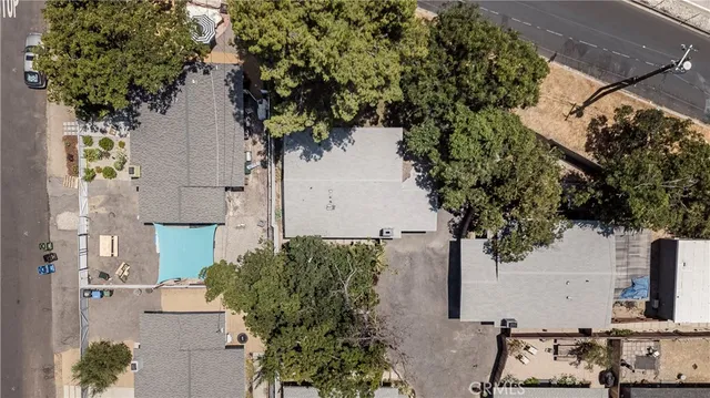 an aerial view of a house with outdoor space