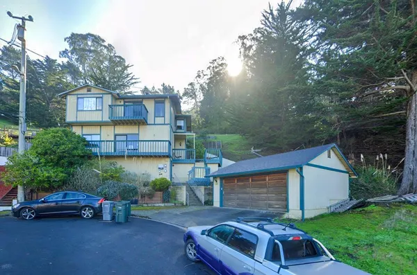 a view of a car in front of a house