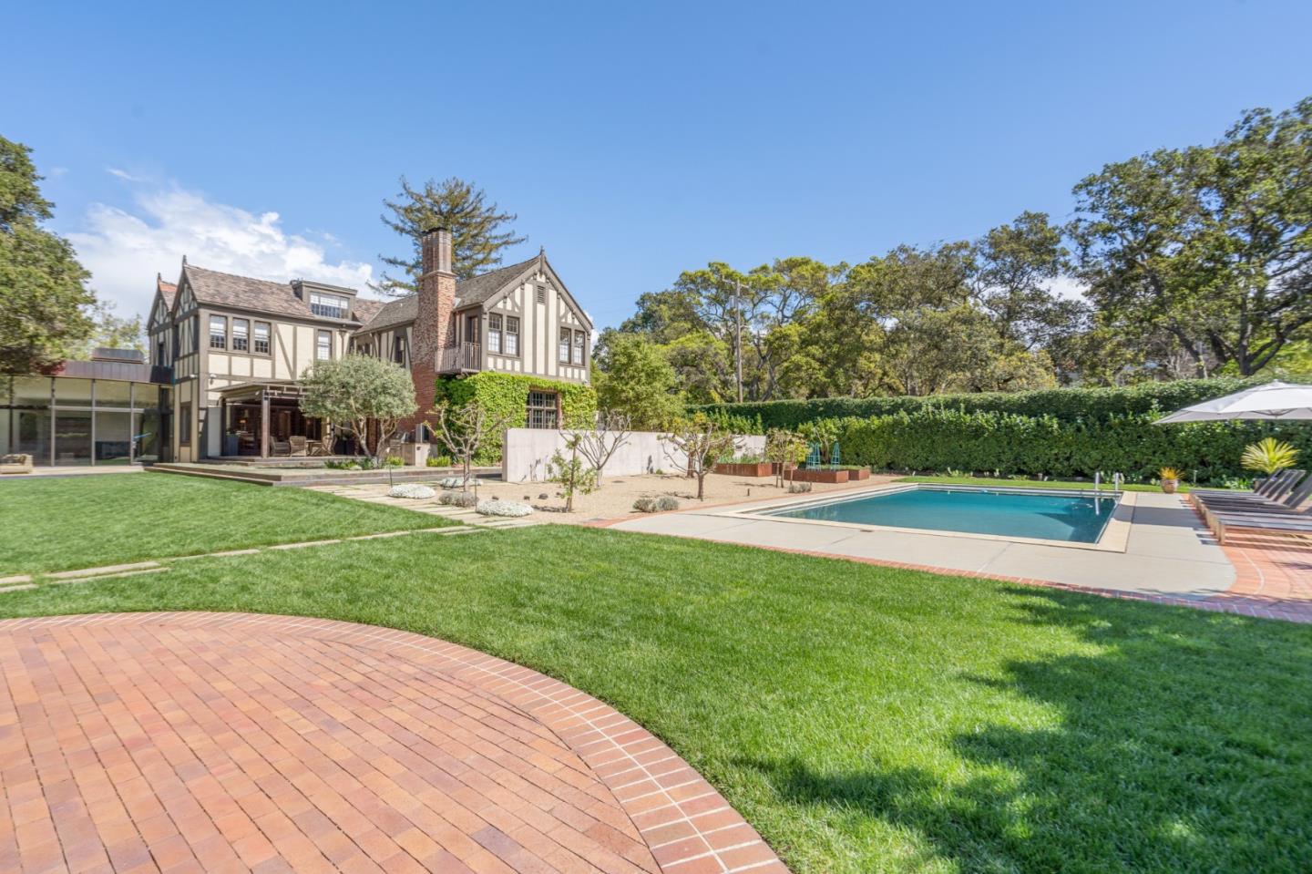 190 Bridge Road Hillsborough, CA 94010 - Photo 2 of 14 a view of a house with a big yard potted plants and large tree