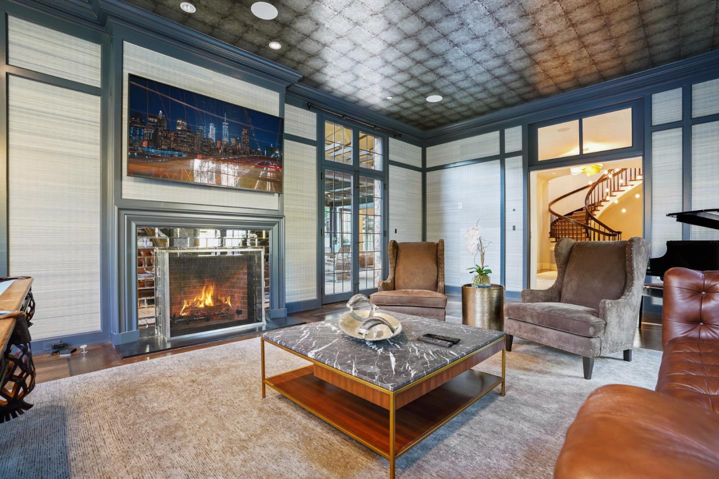 190 Bridge Road Hillsborough, CA 94010 - Photo 5 of 14 a living room with furniture a fireplace and a table