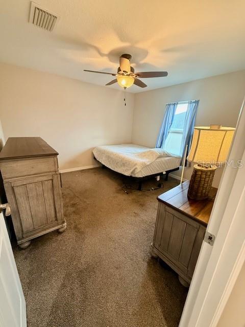 1026 Southeast 65th Circle Ocala, FL 34472 - Photo 13 of 29 a view of a livingroom with furniture and a ceiling fan