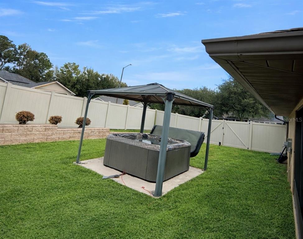 1026 Southeast 65th Circle Ocala, FL 34472 - Photo 23 of 29 a view of a tiny house with backyard