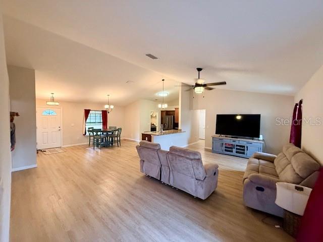 1026 Southeast 65th Circle Ocala, FL 34472 - Photo 5 of 29 a living room with furniture and a flat screen tv