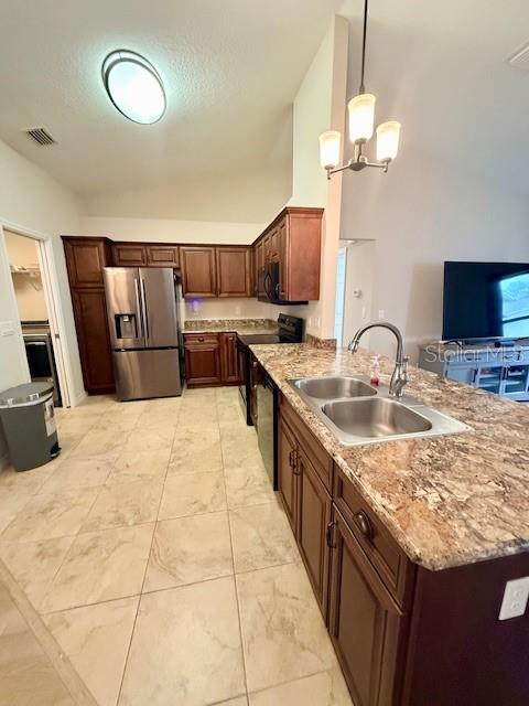 1026 Southeast 65th Circle Ocala, FL 34472 - Photo 8 of 29 a kitchen with kitchen island granite countertop a sink a counter top space appliances and cabinets
