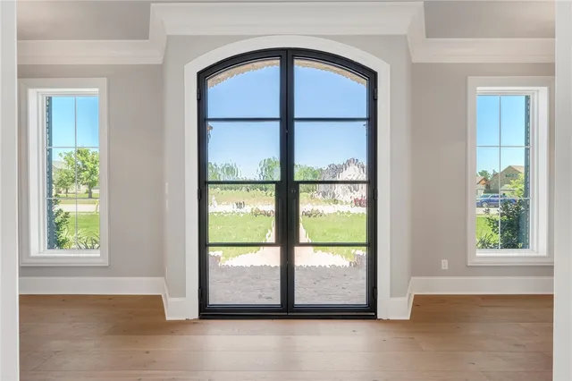 a living room with furniture large window and a fireplace