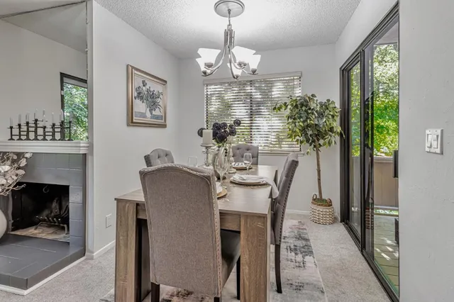 a dining room with furniture a livingroom and chandelier