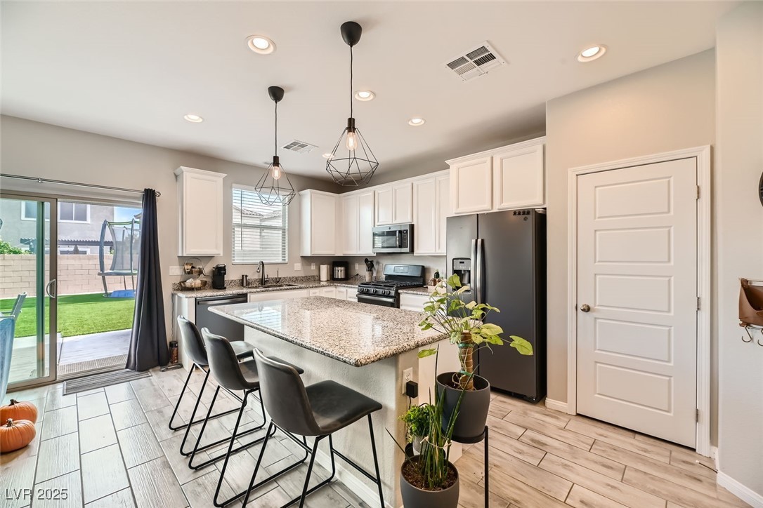 10558 El Camino Road Las Vegas, NV 89141 - Photo 4 of 11 Kitchen with View of Back Yard