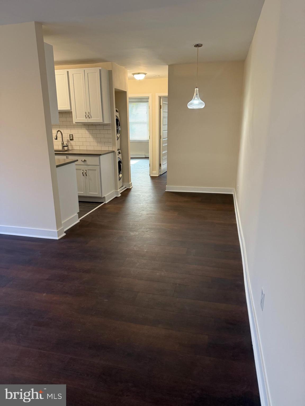 514 Ridge Road Southeast, Unit 111 Washington, DC 20019 - Photo 1 of 9 a view of a kitchen with a sink and cabinets
