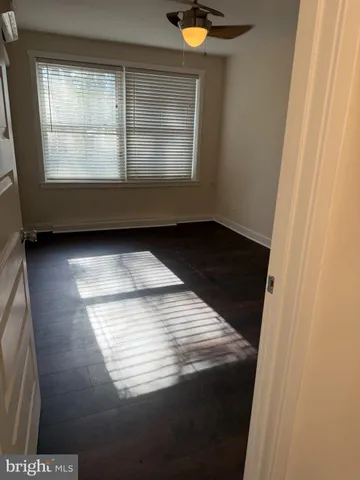 a view of wooden floor and windows in a room