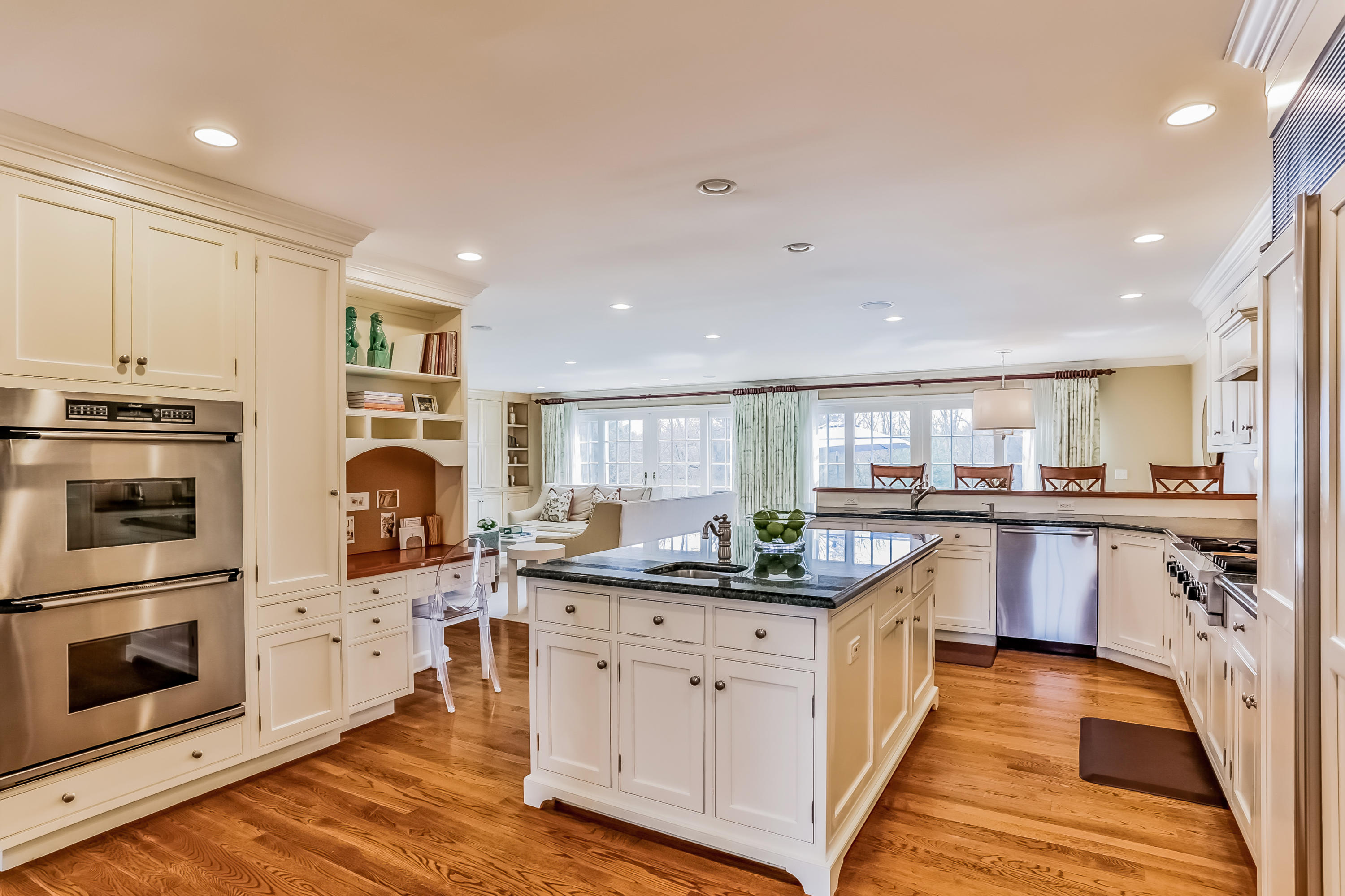 556 Middlesex Road Darien, CT 06820 - Photo 10 of 34 a kitchen with stainless steel appliances granite countertop a sink a stove and cabinets